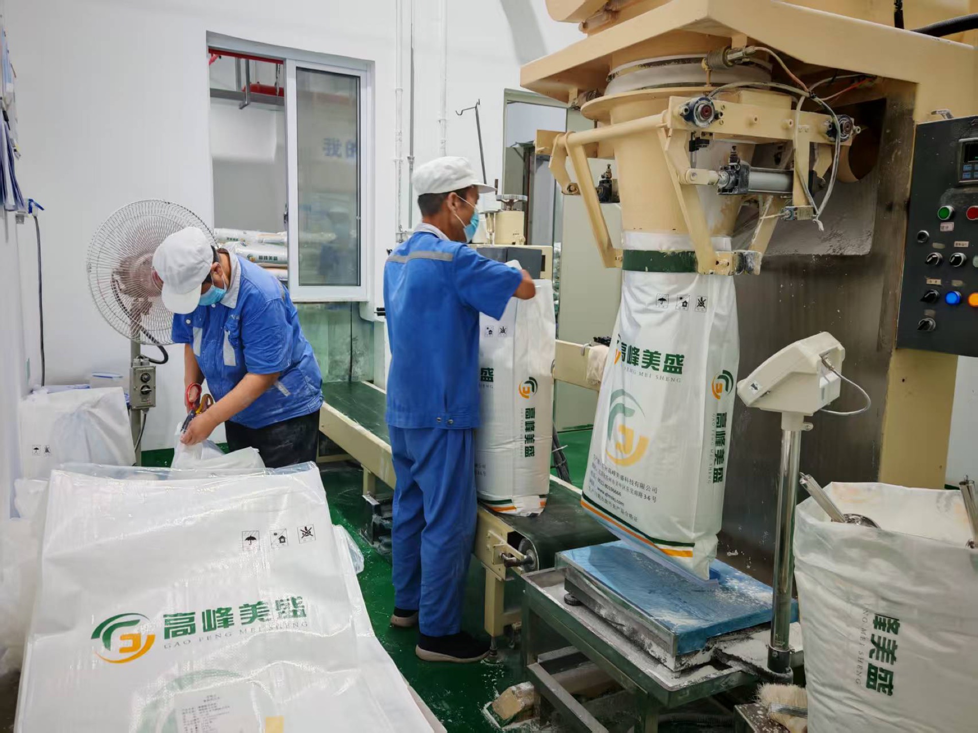 Workers packing modified starch bulk bags on the GFMStech production line