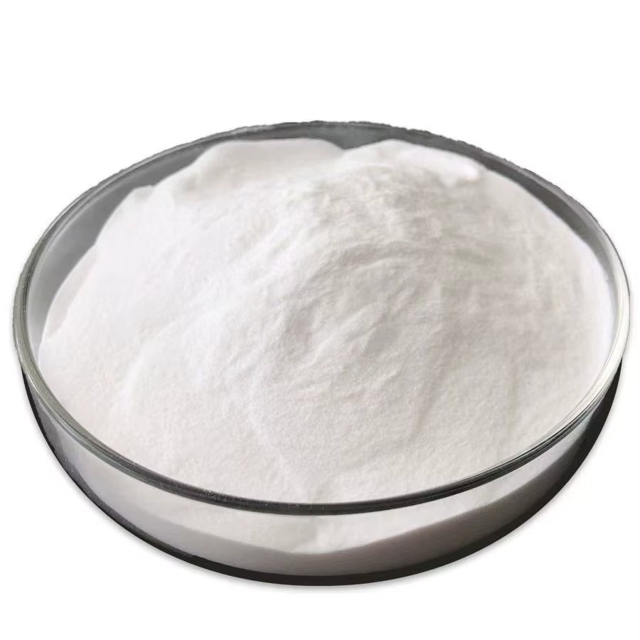 Fine white food grade starch powder in round glass dish on white background
